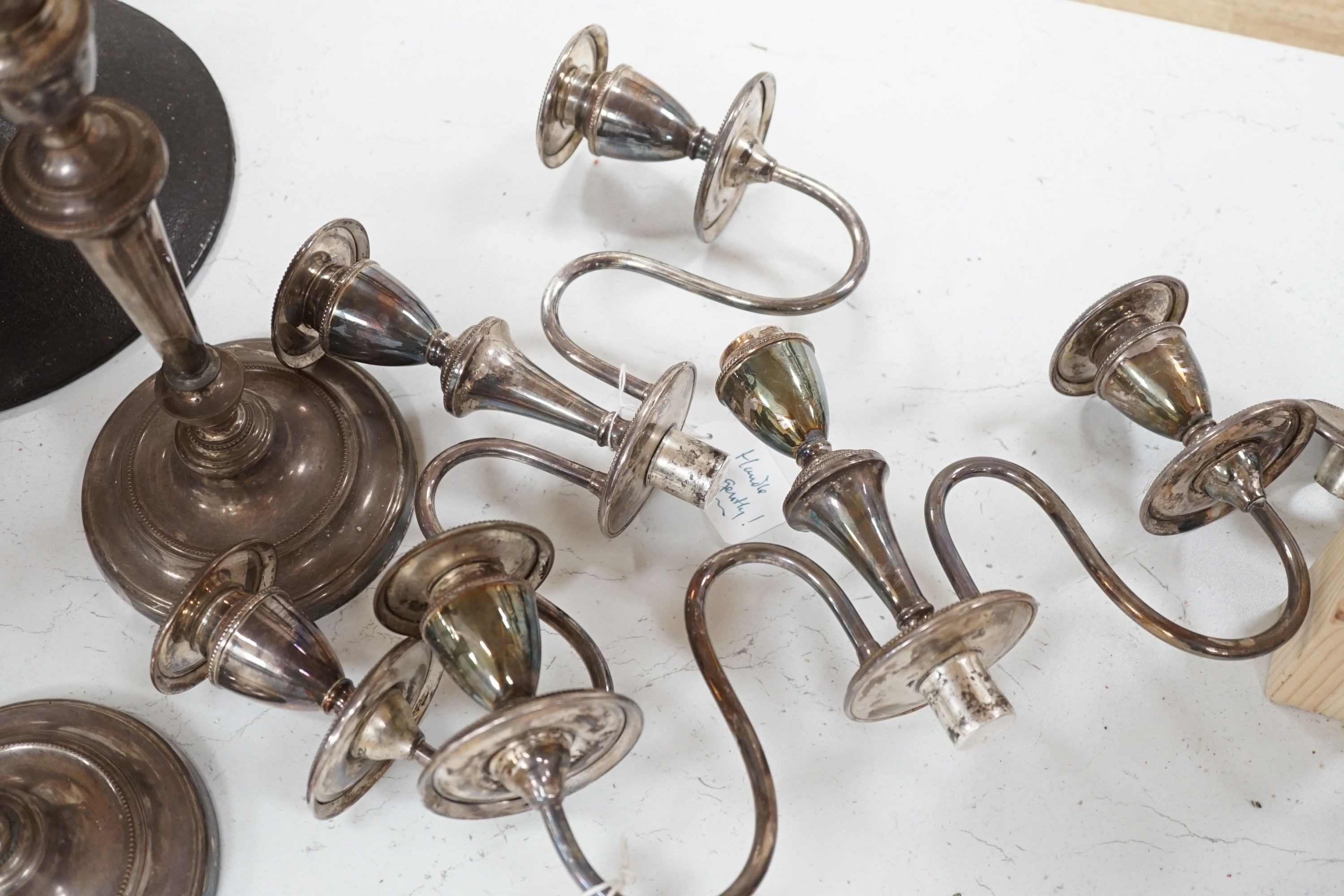 A pair of plated two branch, three light candelabra (1 a.f)